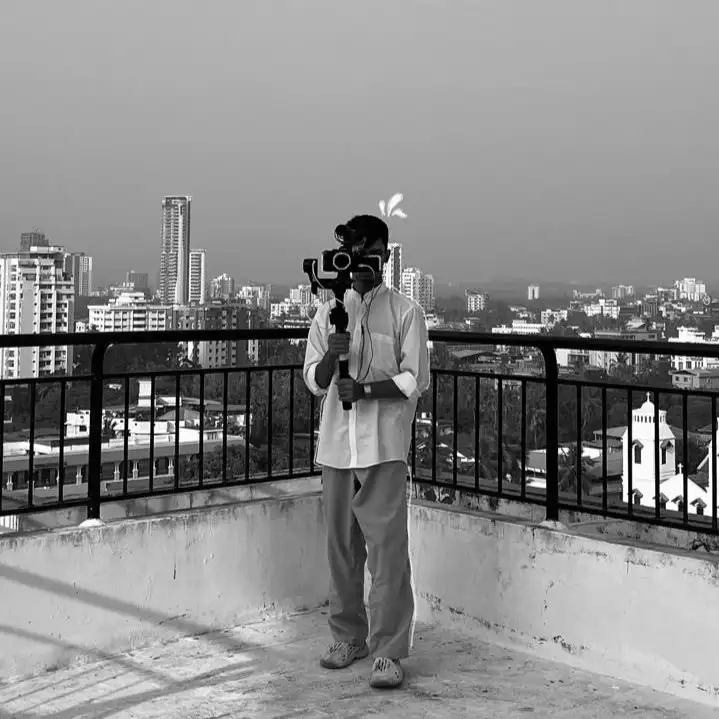 a man holding a camera best digital marketing specialist in calicut